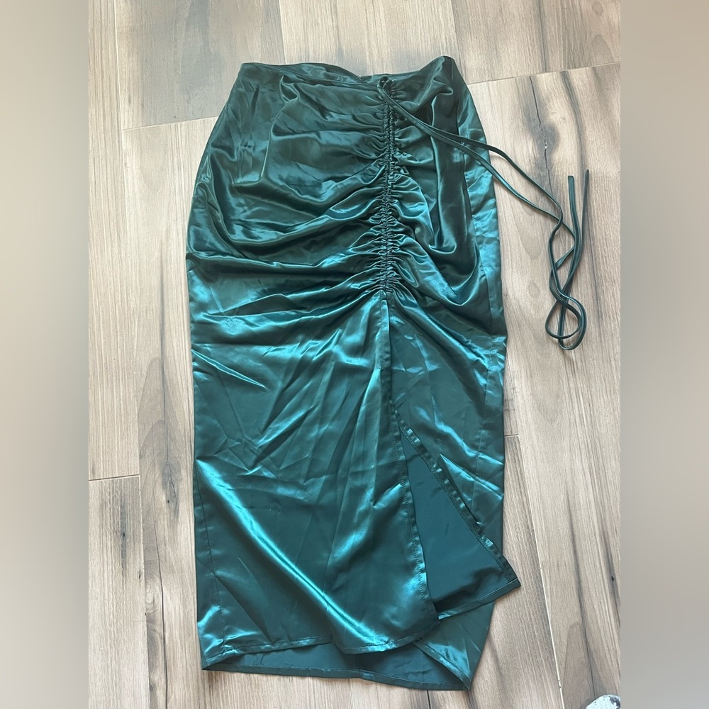 Size small, form fitting, three quarter skirt. Tags removed but never worn.